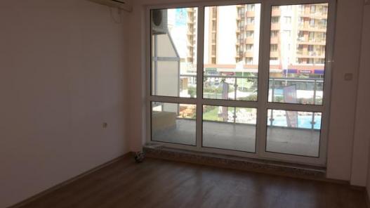 Bedrrom with big windows in the apartment for sale in Sunny Beach