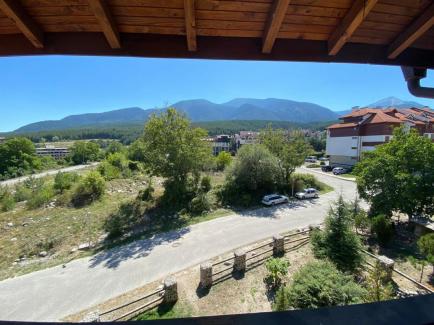 View from the window to the mountain in a one-bedroom apartment in Bansko Id 260